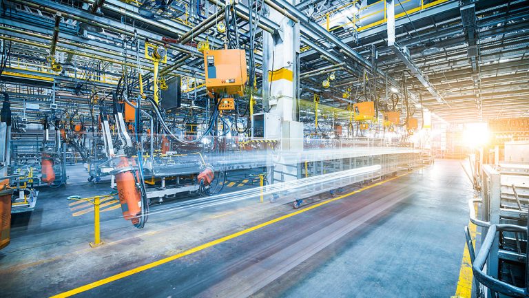 robots welding in a car factory